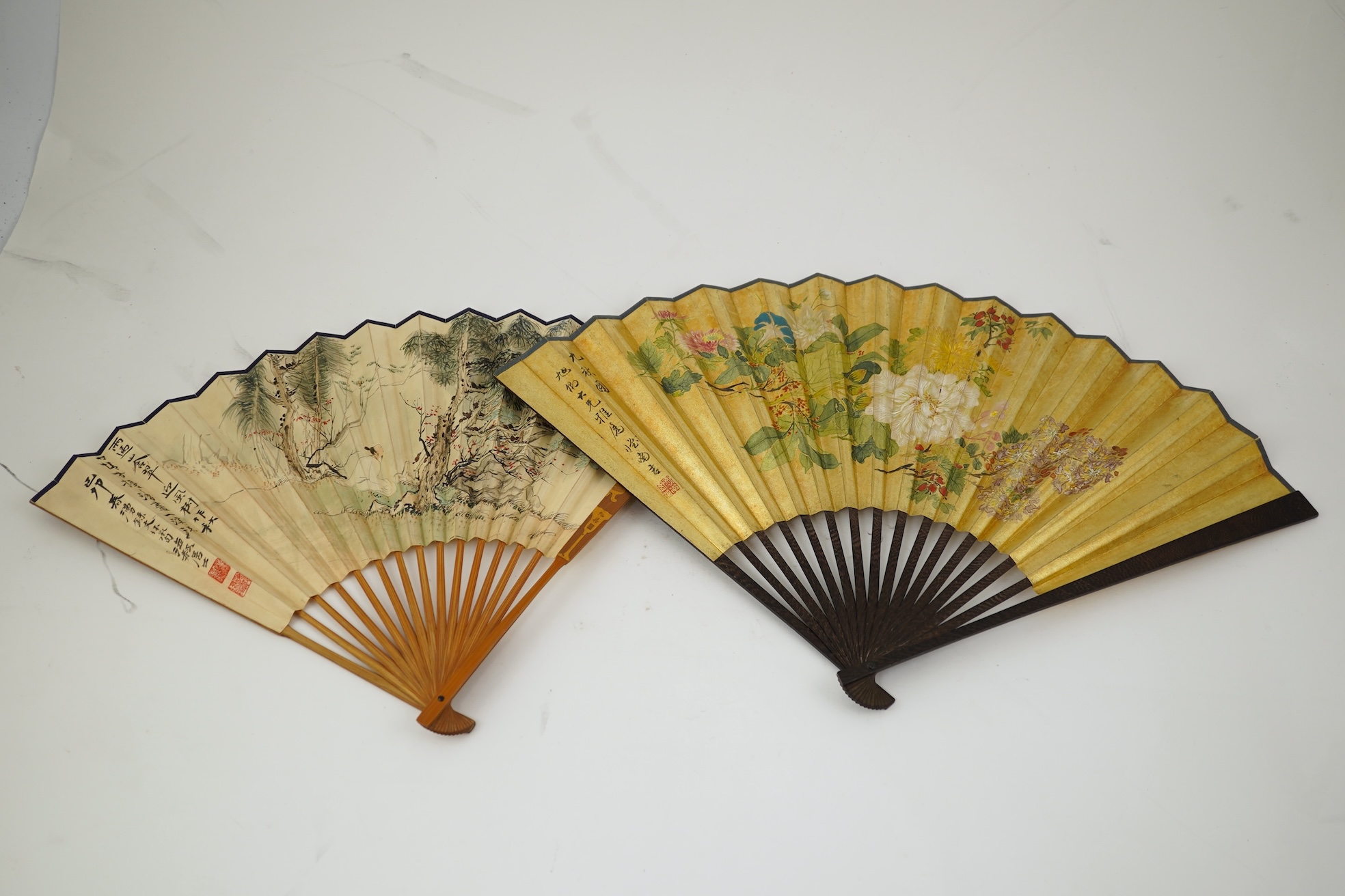 Two Chinese inscribed paper leaf fans, late 19th century